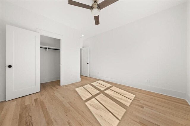 unfurnished bedroom with light wood-type flooring, a closet, and ceiling fan