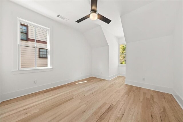 bonus room featuring vaulted ceiling, light hardwood / wood-style flooring, and ceiling fan