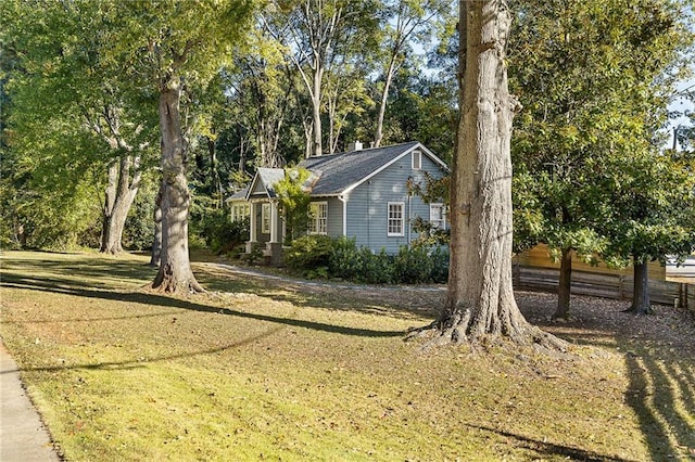 view of home's exterior featuring a lawn