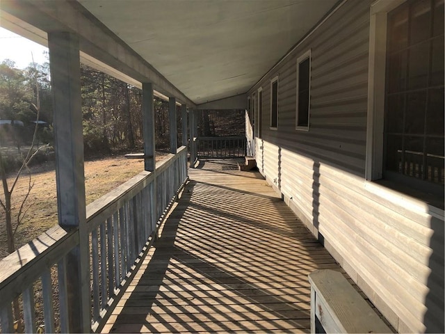 wooden terrace featuring a porch