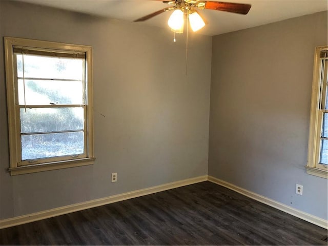 spare room featuring ceiling fan and dark hardwood / wood-style floors