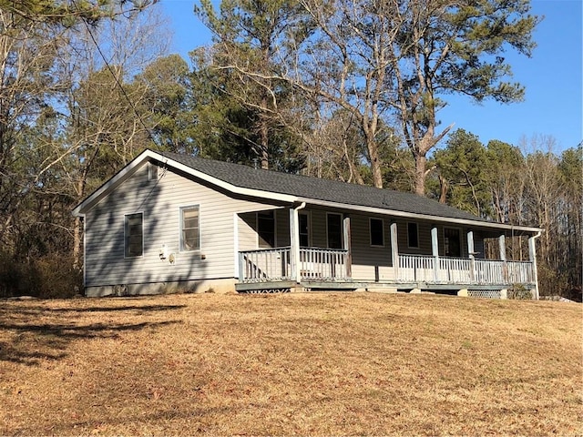 single story home featuring a front lawn and covered porch