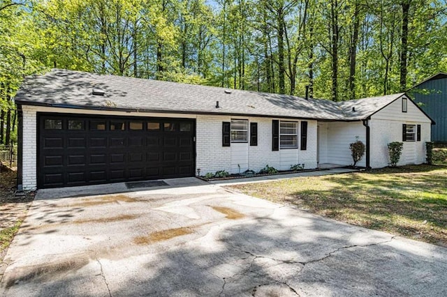 1781 Jajef Ave, Conley, GA 30288 - ranch-style home with an attached garage, driveway, and brick siding