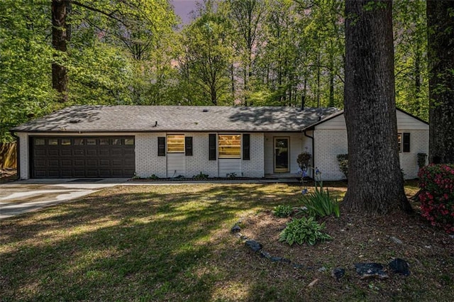 1781 Jajef Ave, Conley, GA 30288 - ranch-style house featuring concrete driveway, brick siding, a front yard, and a garage