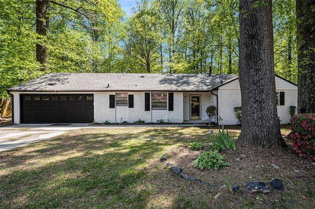1781 Jajef Ave, Conley, GA 30288 - ranch-style home with a garage, brick siding, a front yard, and concrete driveway