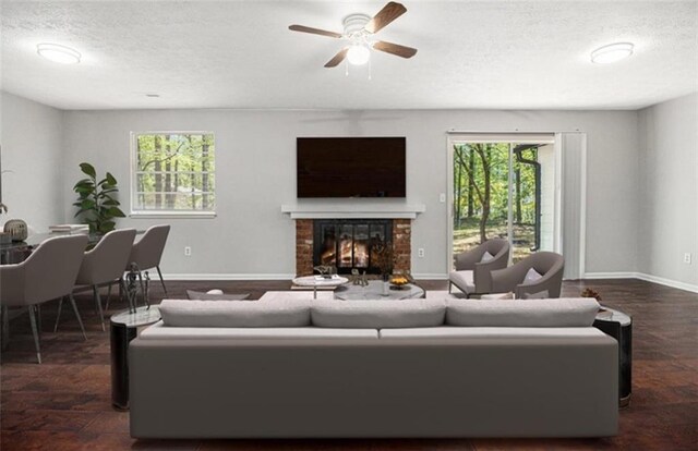 1781 Jajef Ave, Conley, GA 30288 - living room featuring ceiling fan, baseboards, a brick fireplace, and a textured ceiling