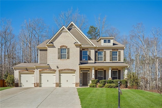 craftsman inspired home featuring driveway, a front lawn, and brick siding