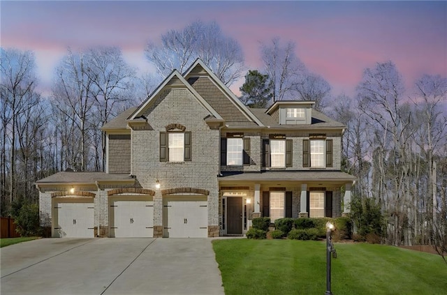 3610 Ansley Manor Ct, Cumming, GA 30028 - view of front of house featuring driveway, a lawn, brick siding, and a garage