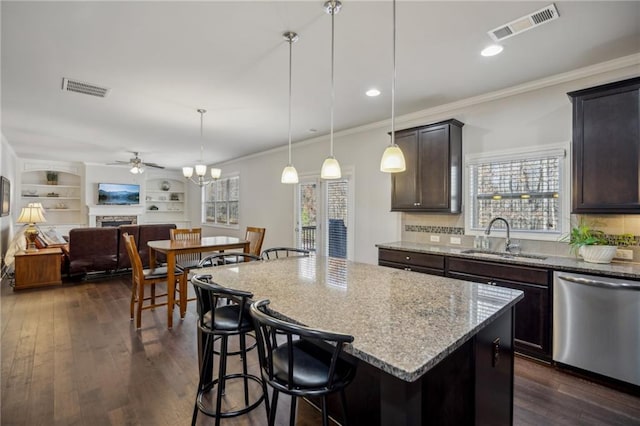3610 Ansley Manor Ct, Cumming, GA 30028 - kitchen featuring stainless steel dishwasher, a sink, a ceiling fan, light stone counters, and plenty of natural light