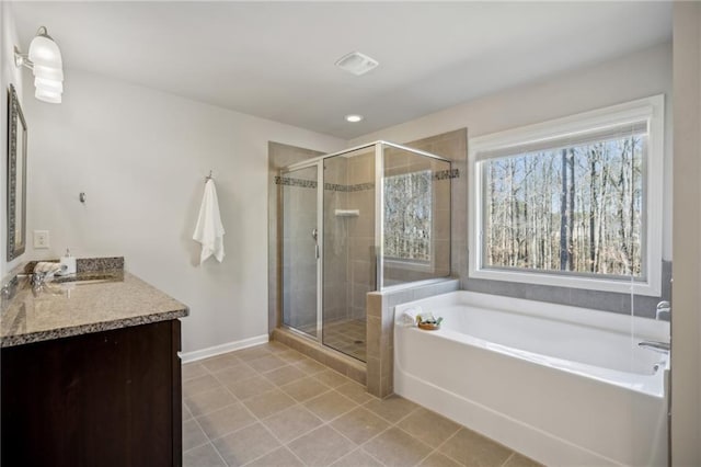 3610 Ansley Manor Ct, Cumming, GA 30028 - full bathroom featuring a bath, vanity, a shower stall, tile patterned floors, and baseboards