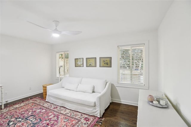 interior space with ceiling fan, baseboards, and wood finished floors