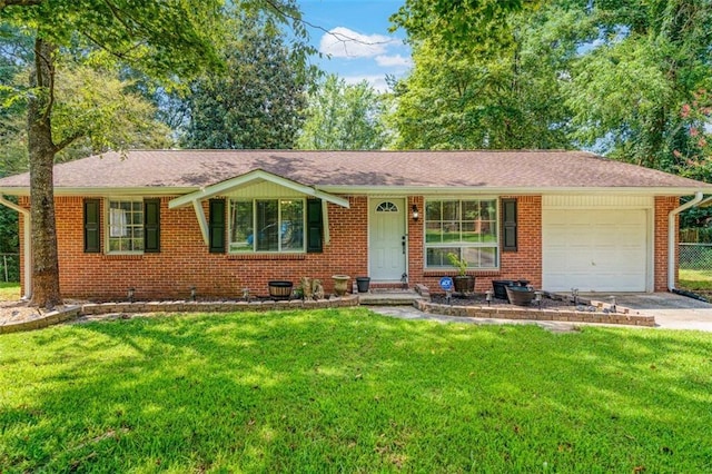 57 Jonathan Rd, Riverdale, GA 30274 - view of front facade featuring an attached garage, brick siding, and driveway