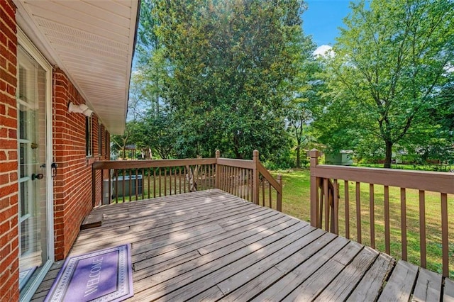 57 Jonathan Rd, Riverdale, GA 30274 - wooden deck featuring a lawn