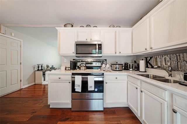 57 Jonathan Rd, Riverdale, GA 30274 - kitchen with stainless steel appliances, a sink, white cabinetry, and light countertops