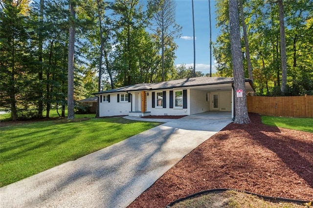 single story home featuring a carport and a front yard