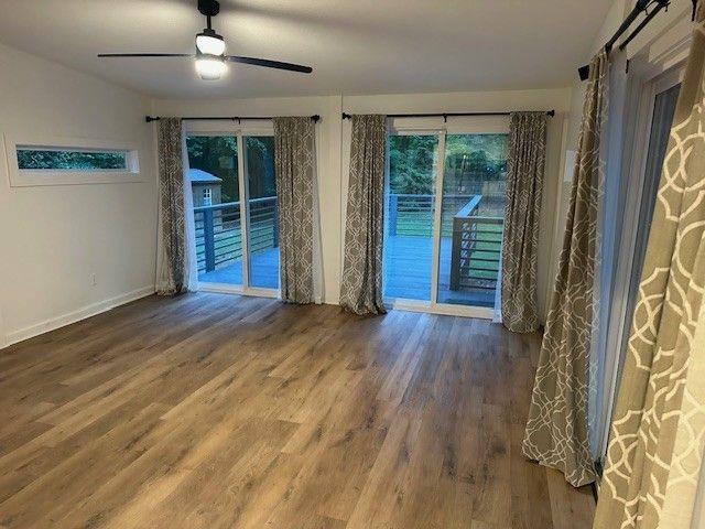 1360 Bethany Ct, Alpharetta, GA 30004 - unfurnished room featuring a ceiling fan and wood finished floors