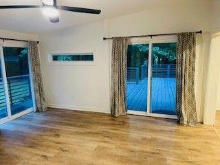 1360 Bethany Ct, Alpharetta, GA 30004 - empty room featuring wood finished floors and a ceiling fan