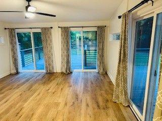 1360 Bethany Ct, Alpharetta, GA 30004 - spare room with wood finished floors and lofted ceiling