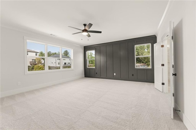 unfurnished room featuring ceiling fan and light colored carpet