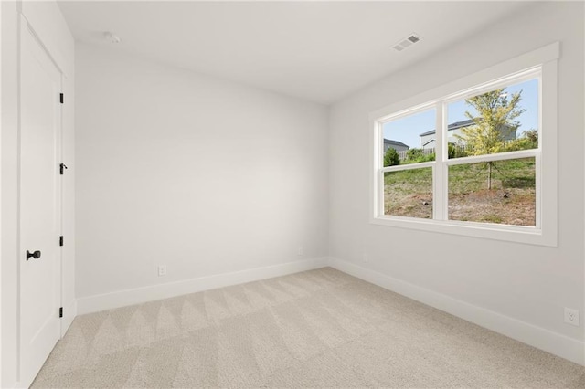 unfurnished bedroom featuring light carpet