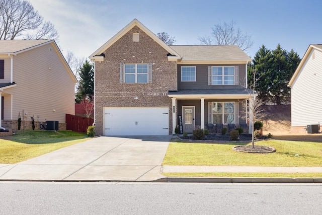 view of front facade featuring brick siding, a front yard, a garage, cooling unit, and driveway