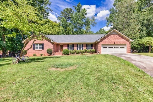 ranch-style house with a front yard, brick siding, driveway, and an attached garage