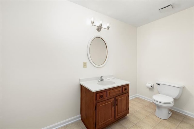 bathroom with toilet, baseboards, visible vents, and vanity