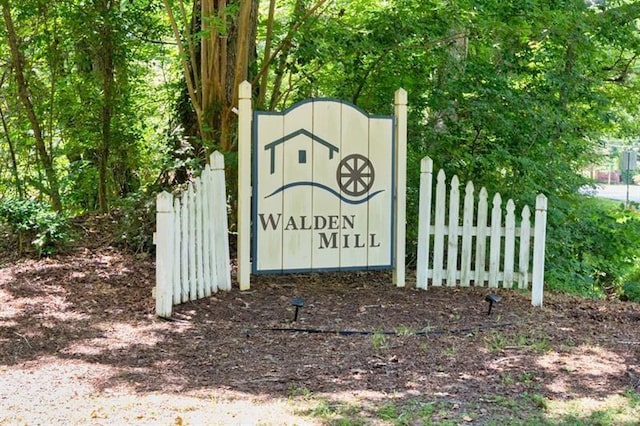 community sign with fence