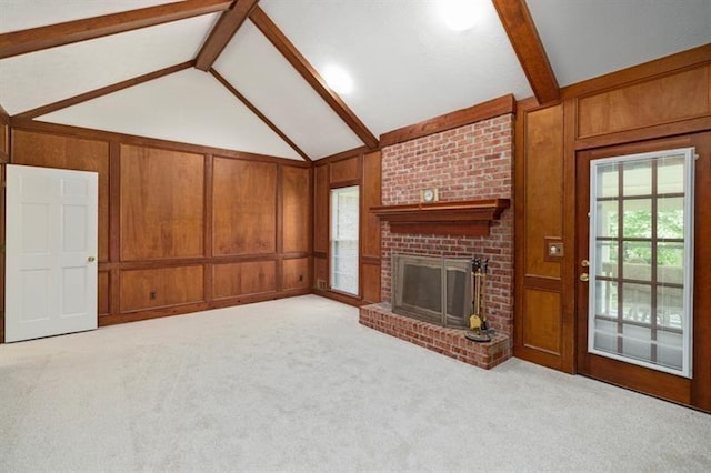 unfurnished living room with light colored carpet, vaulted ceiling with beams, and wooden walls