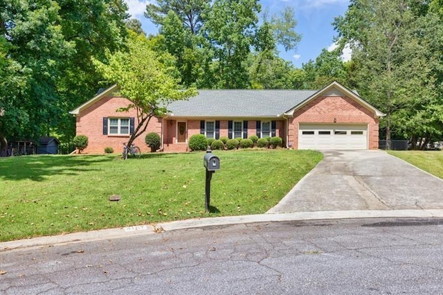 ranch-style house featuring a garage, a front yard, and concrete driveway