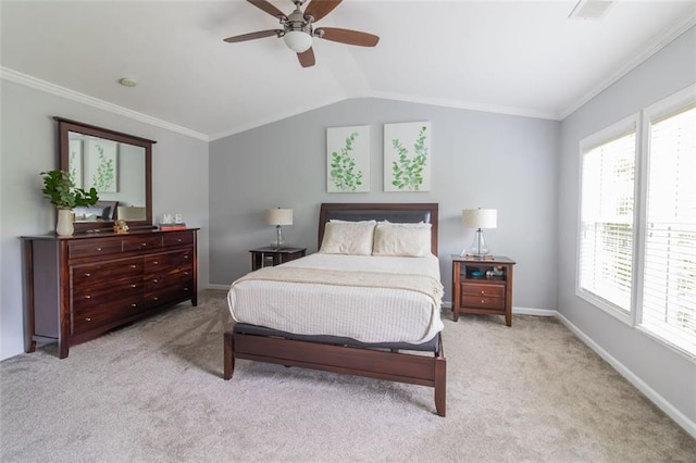 carpeted bedroom with lofted ceiling, crown molding, and ceiling fan