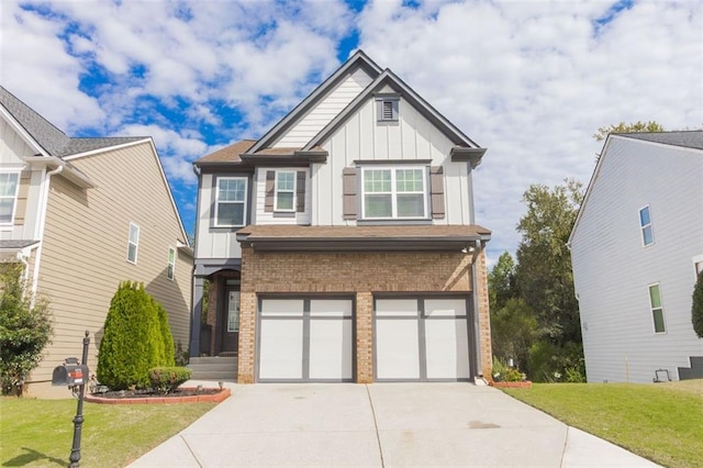 view of front of property featuring a front lawn and a garage