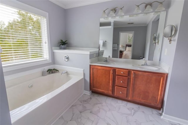 bathroom featuring vanity, ornamental molding, and a bathing tub