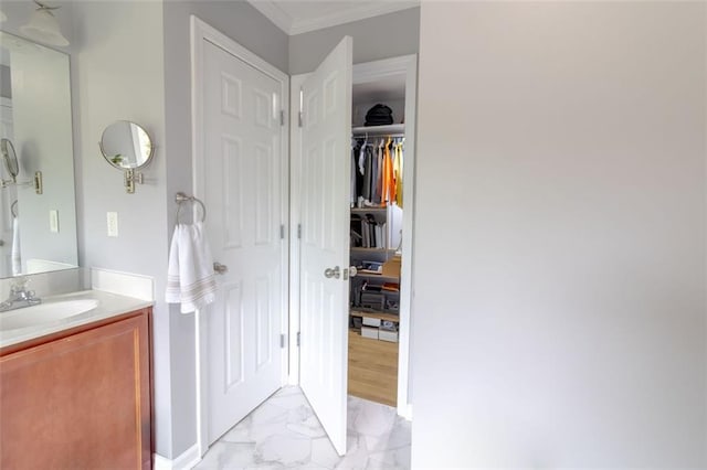 bathroom featuring vanity and crown molding