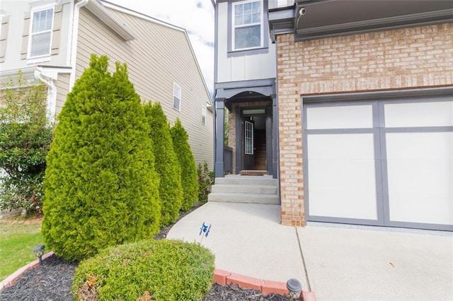 view of exterior entry featuring a garage