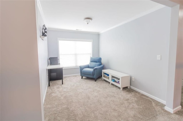 sitting room with ornamental molding and light colored carpet