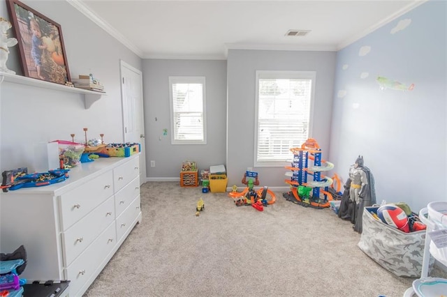 playroom featuring ornamental molding and light colored carpet