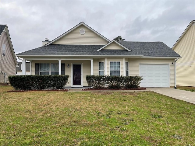 view of front of property with an attached garage, a shingled roof, concrete driveway, and a front yard