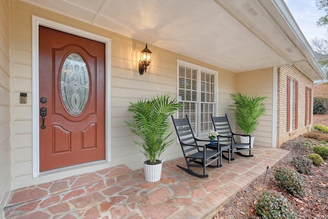 property entrance featuring covered porch