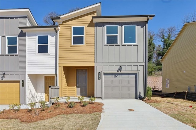 view of front facade featuring a garage, board and batten siding, and concrete driveway