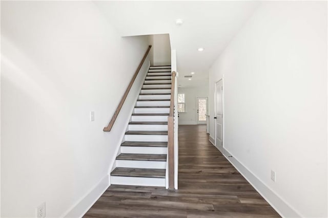 stairs with recessed lighting, wood finished floors, and baseboards