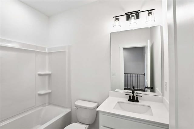 bathroom with shower / bath combination, toilet, and vanity