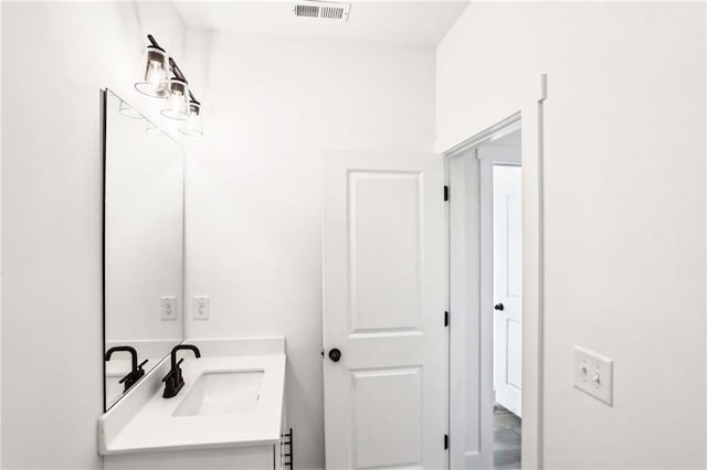 bathroom featuring visible vents and vanity