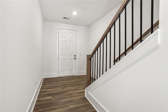 staircase featuring visible vents, recessed lighting, wood finished floors, and baseboards