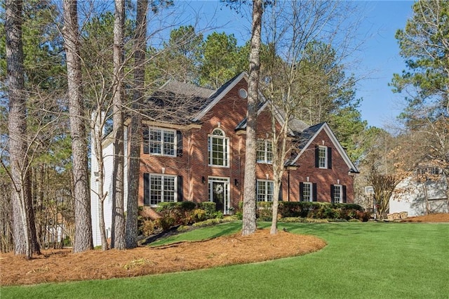 entrance to property featuring brick siding