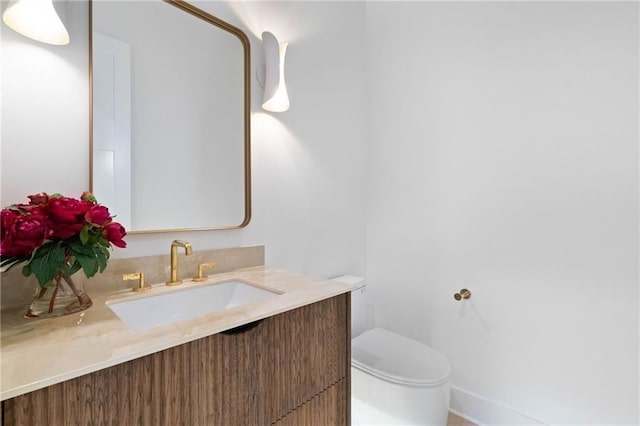 bathroom with vanity and toilet