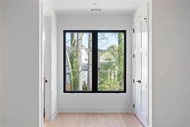 doorway to outside with light hardwood / wood-style floors