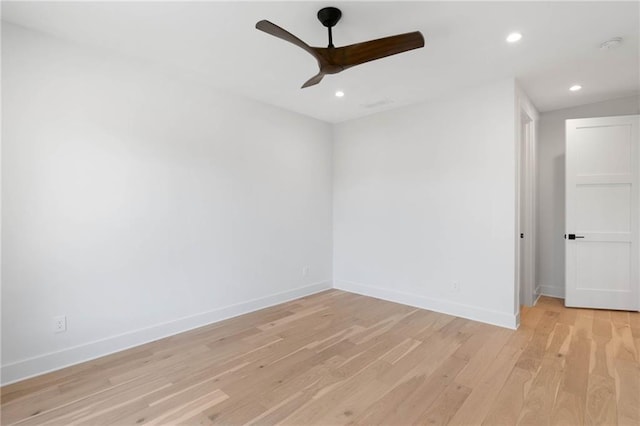 unfurnished room with lofted ceiling, light hardwood / wood-style flooring, and ceiling fan