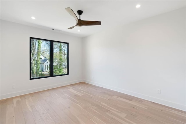 empty room with light hardwood / wood-style flooring and ceiling fan