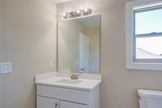 bathroom with vanity and toilet